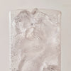Panera drink being pouring into a cup of ice including some fruit